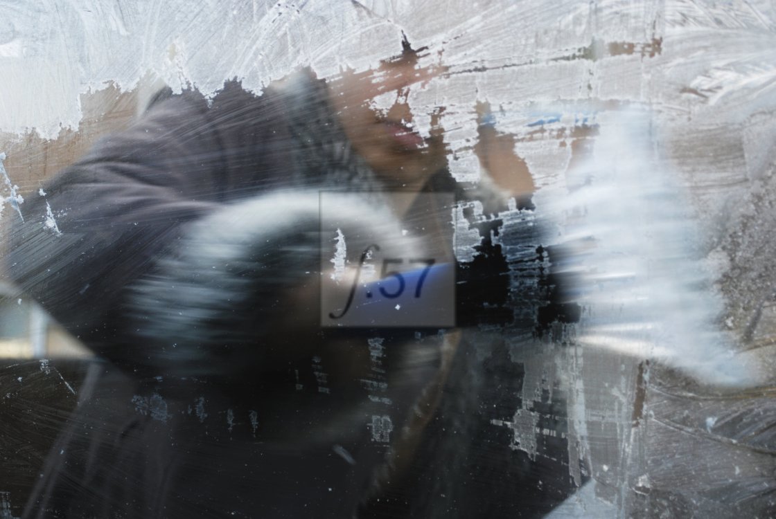 "Scraping winter ice from car windows. Seen from interior with motion blur action." by HD57 lifestyle stock photography - $29.82 "Scraping winter ice from car windows. Seen from interior with motion blur action." stock image