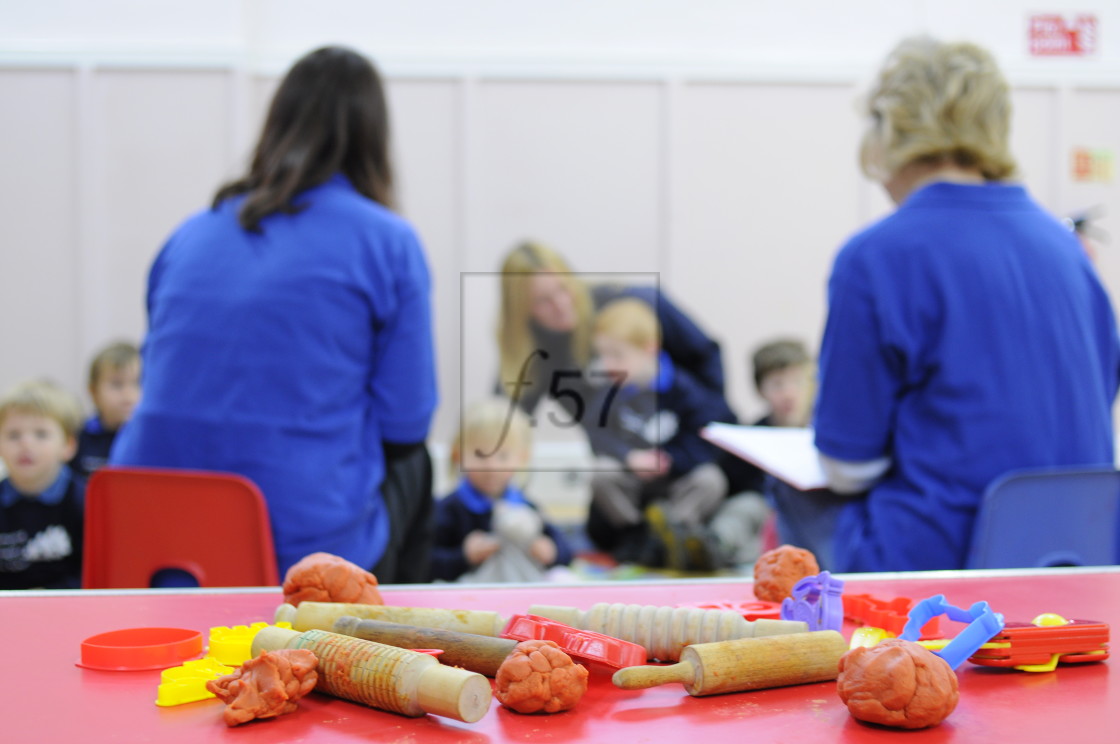 "Preschool teachers and children start the day with registration." by HD57 lifestyle stock photography - $29.40 "Preschool teachers and children start the day with registration." stock image