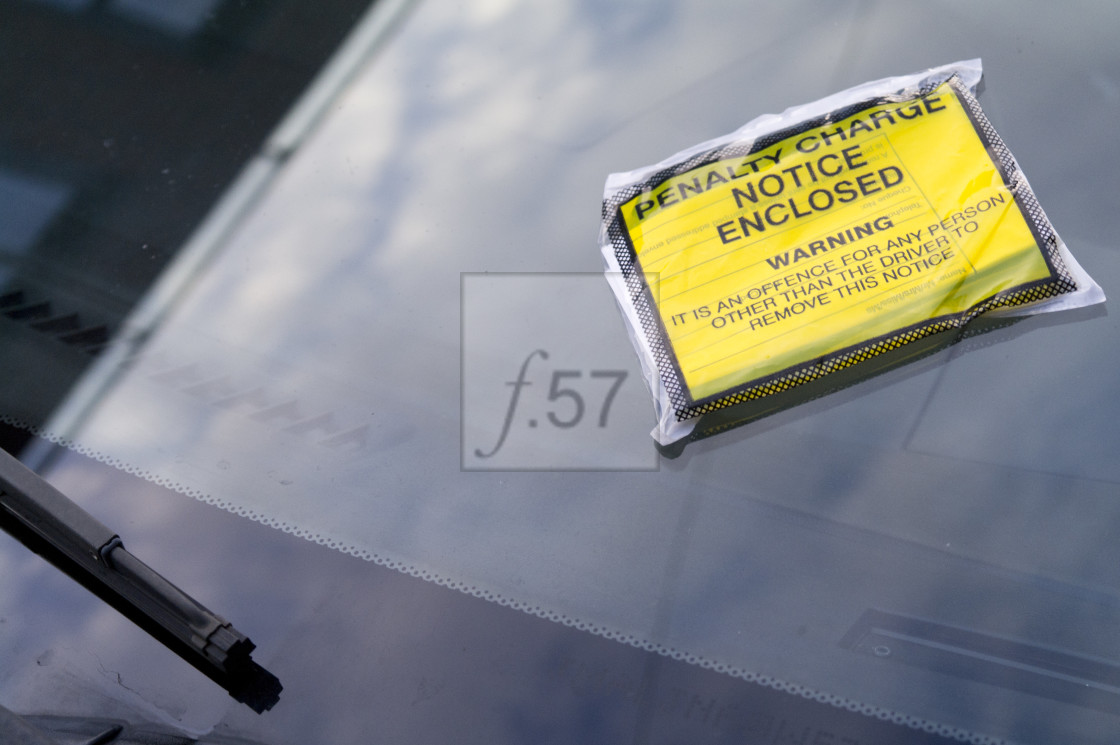 "Penalty charge notice parking ticket on car windscreen." by HD57 lifestyle stock photography - $29.40 "Penalty charge notice parking ticket on car windscreen." stock image