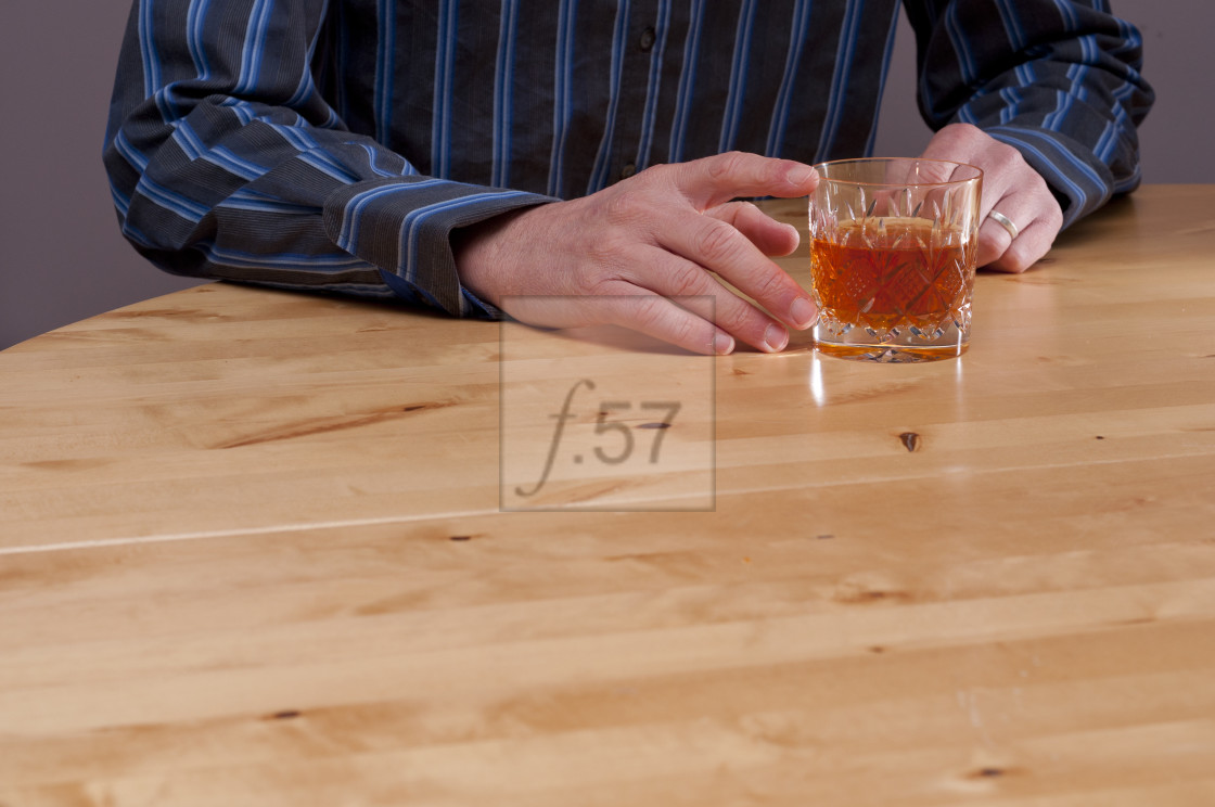 "Depressed stressed man with alcohol." stock image