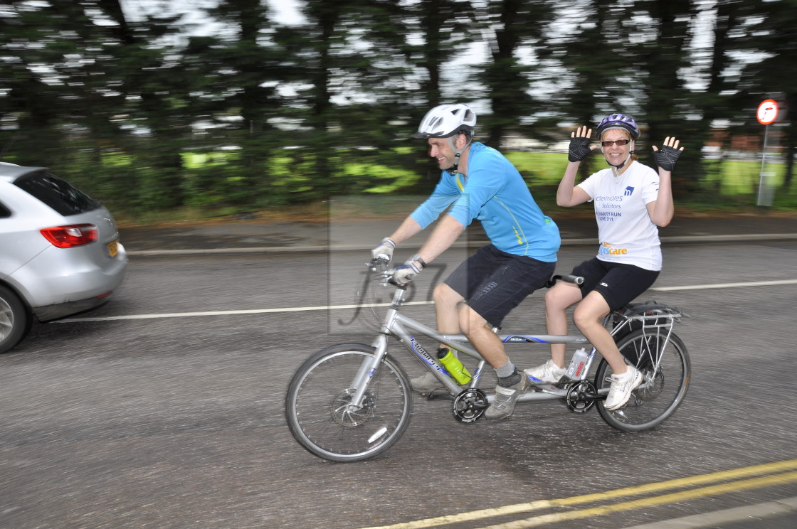 "Cyclists riding a tandem during a mass participation sportive ride" stock image