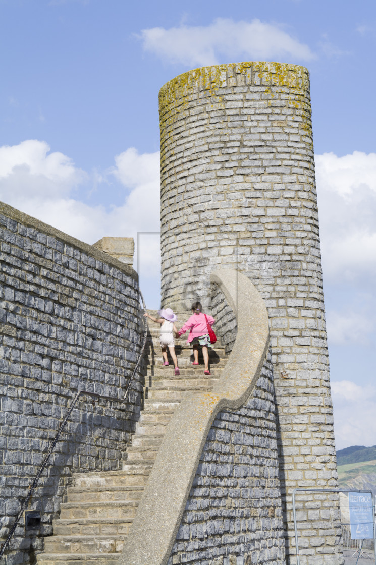 "Young children explore Lyme Regis old town history." stock image