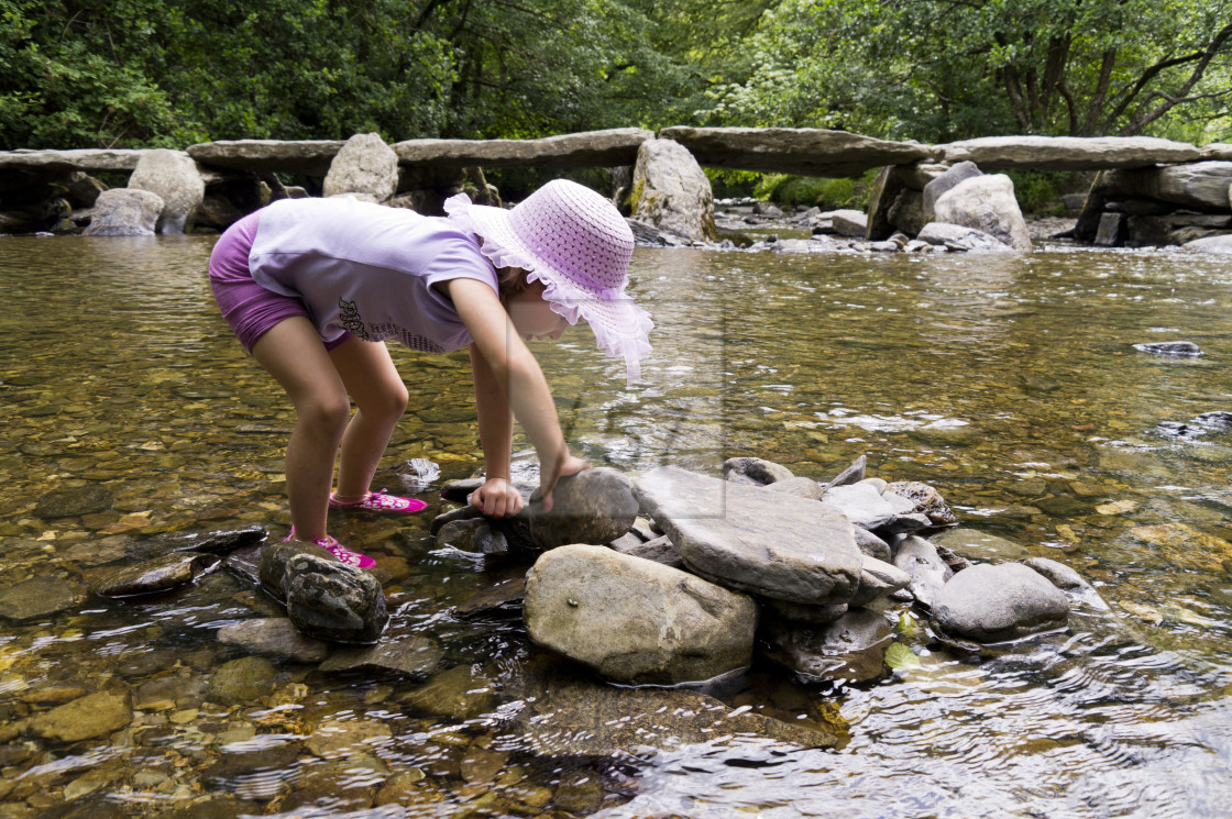 "Young child exploring Tar Steps Exmoor" stock image