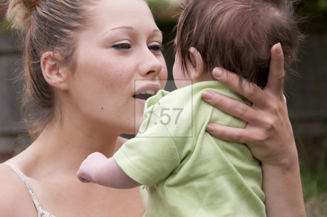 "Young mother with 9 week old baby boy." stock image