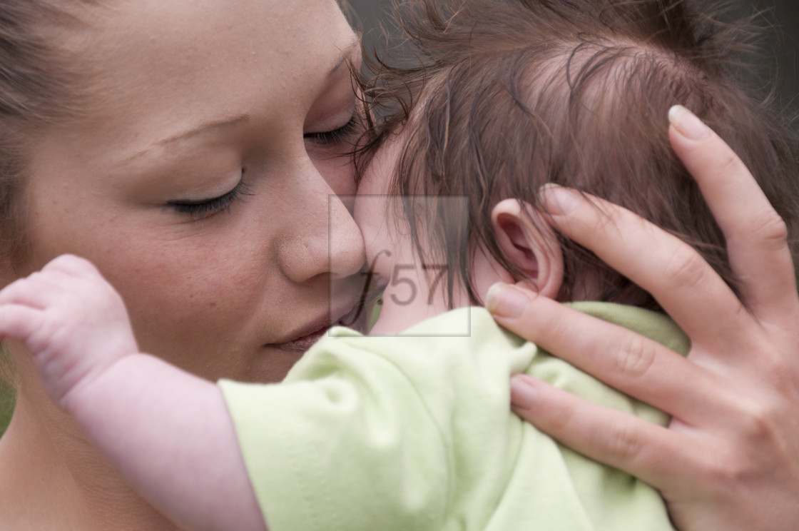 "Young mother with 9 week old baby boy." stock image