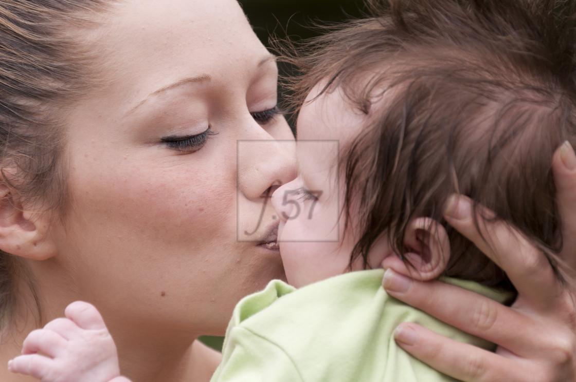 "Young mother with 9 week old baby boy." stock image