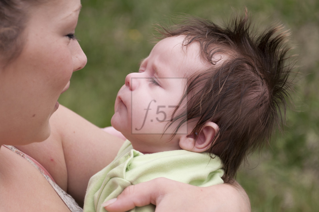 "Young mother with 9 week old baby boy." stock image