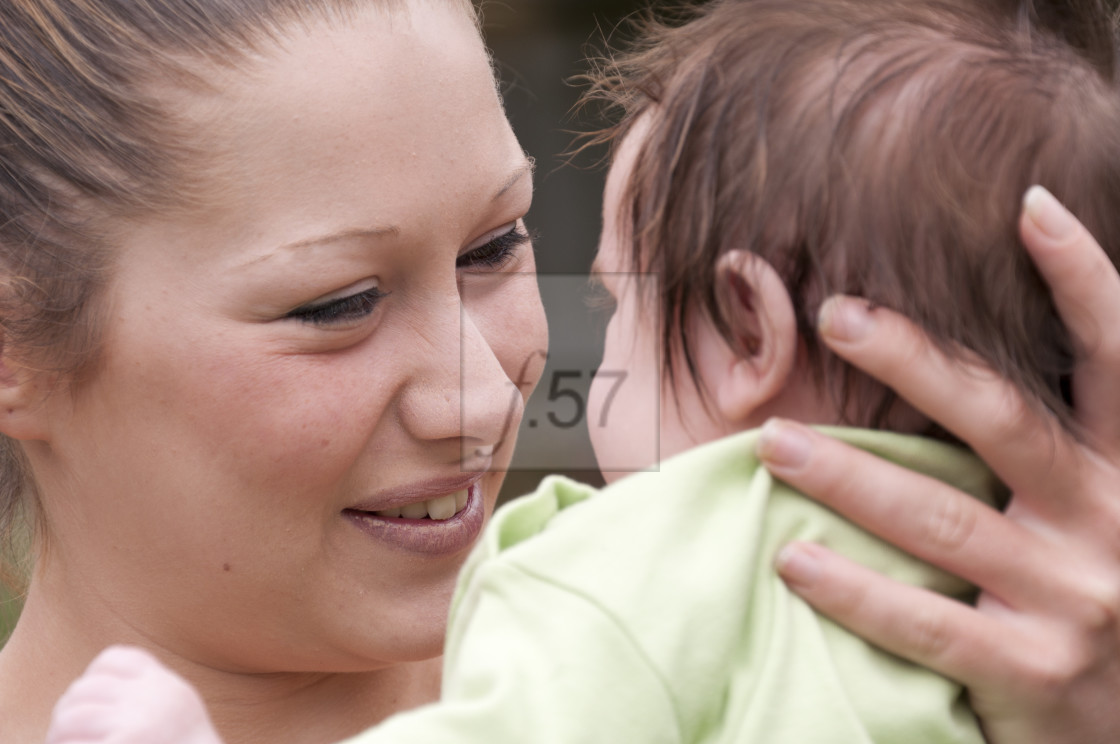 "Young mother with 9 week old baby boy." stock image