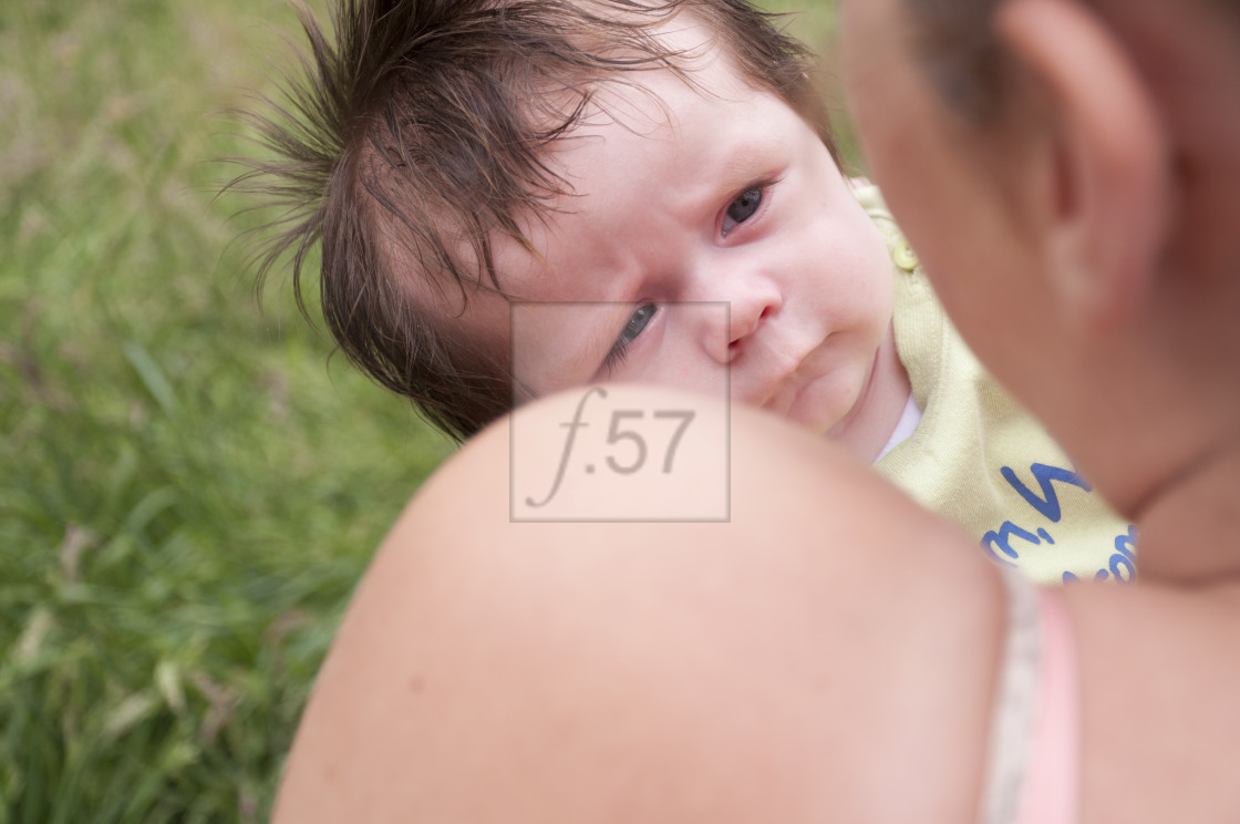 "Young mother with 9 week old baby boy." stock image