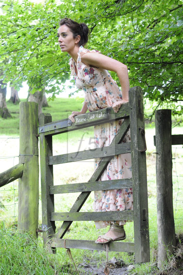 "Attractive brunette woman in rural setting" stock image