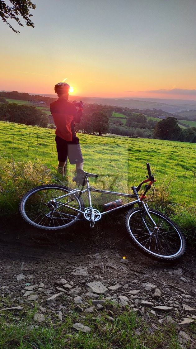 "Capturing sunset during an evening trail ride" stock image