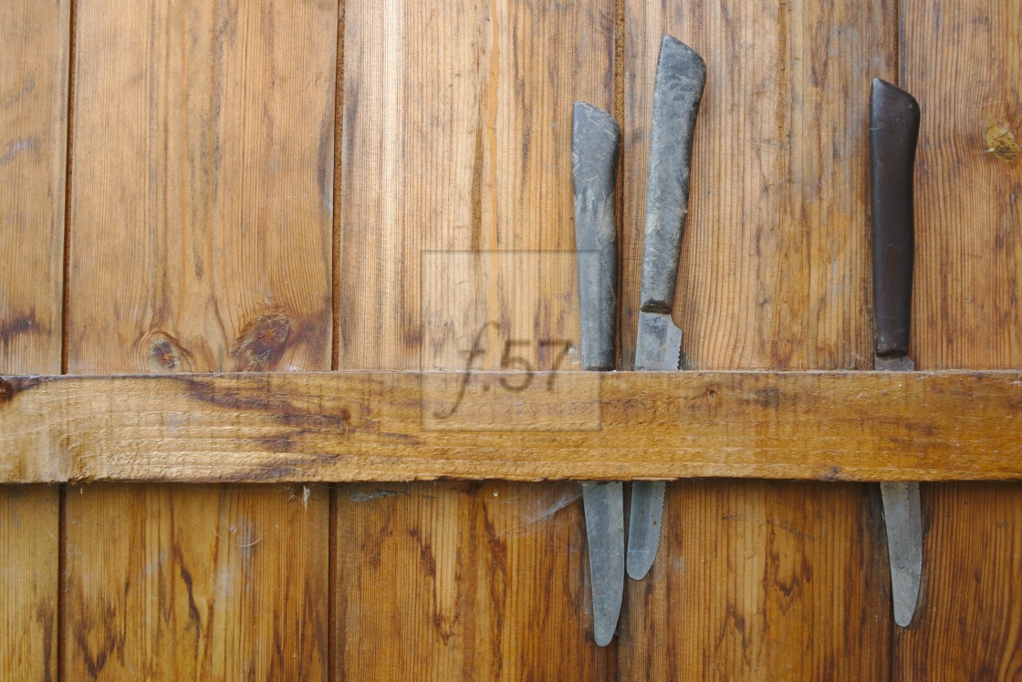 "knives stored behind shed door at an allotment" stock image