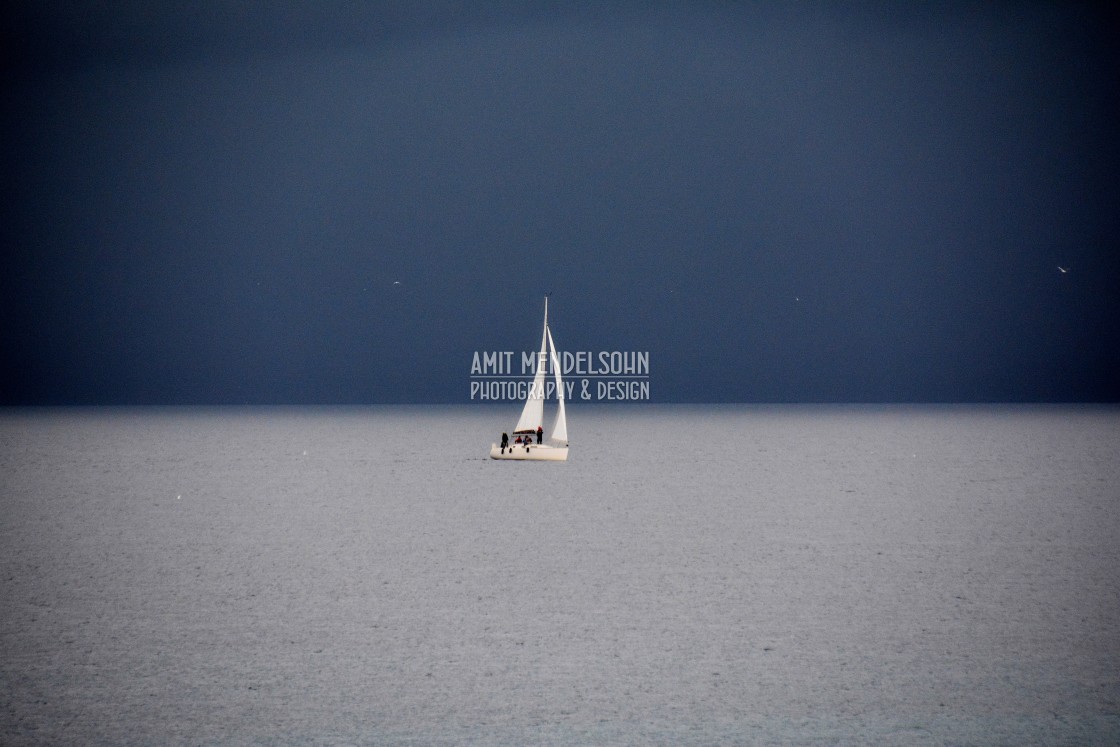 "A boat on a dark day" stock image