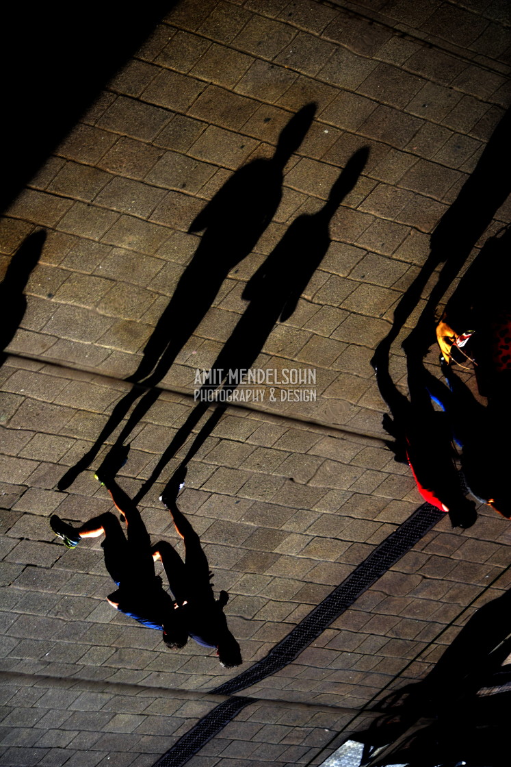 "Runners and their shadows" stock image