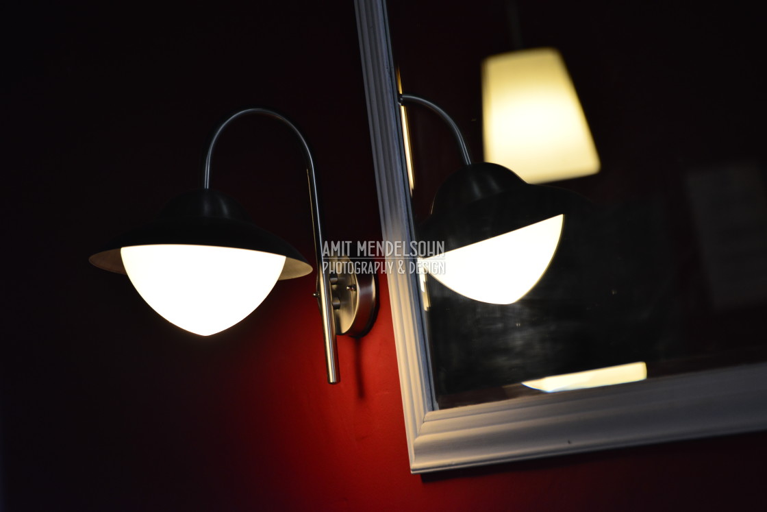 "A lamp and it's reflection" stock image