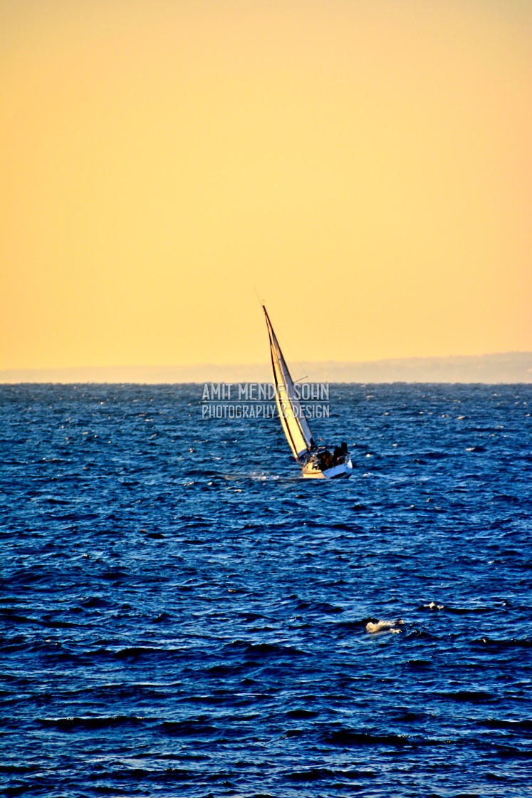 "A boat in the sunset" stock image