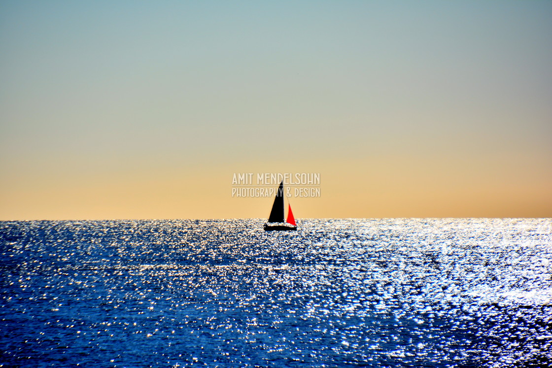 "A sailing boat in the horizon" stock image