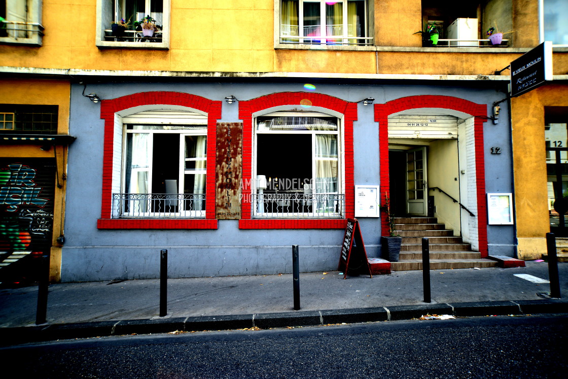 "A restaurant with windows and doors framed in red" stock image