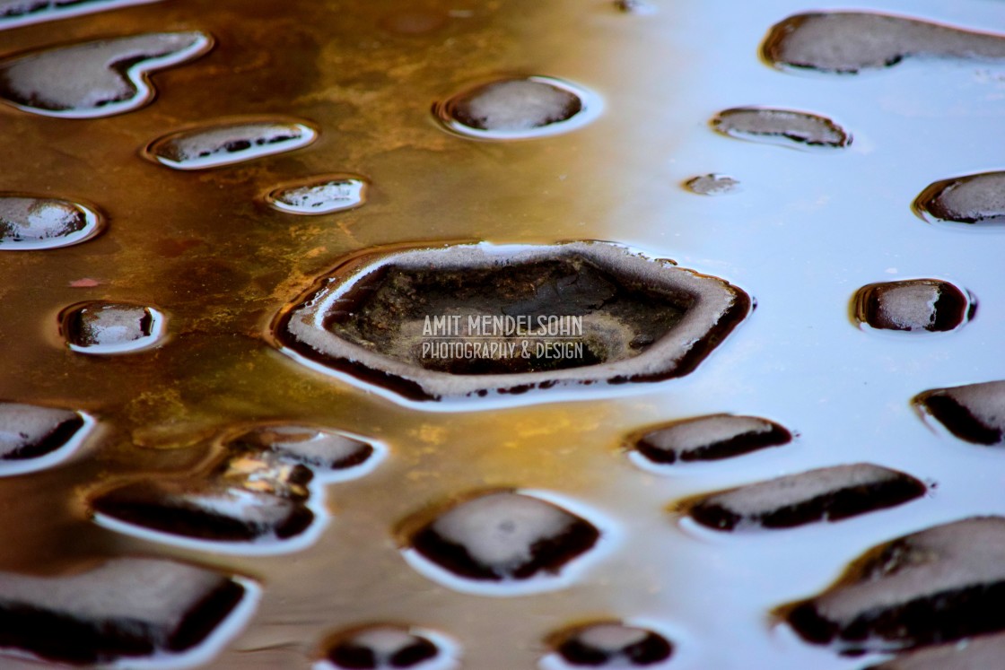 "Water on a manhole" stock image