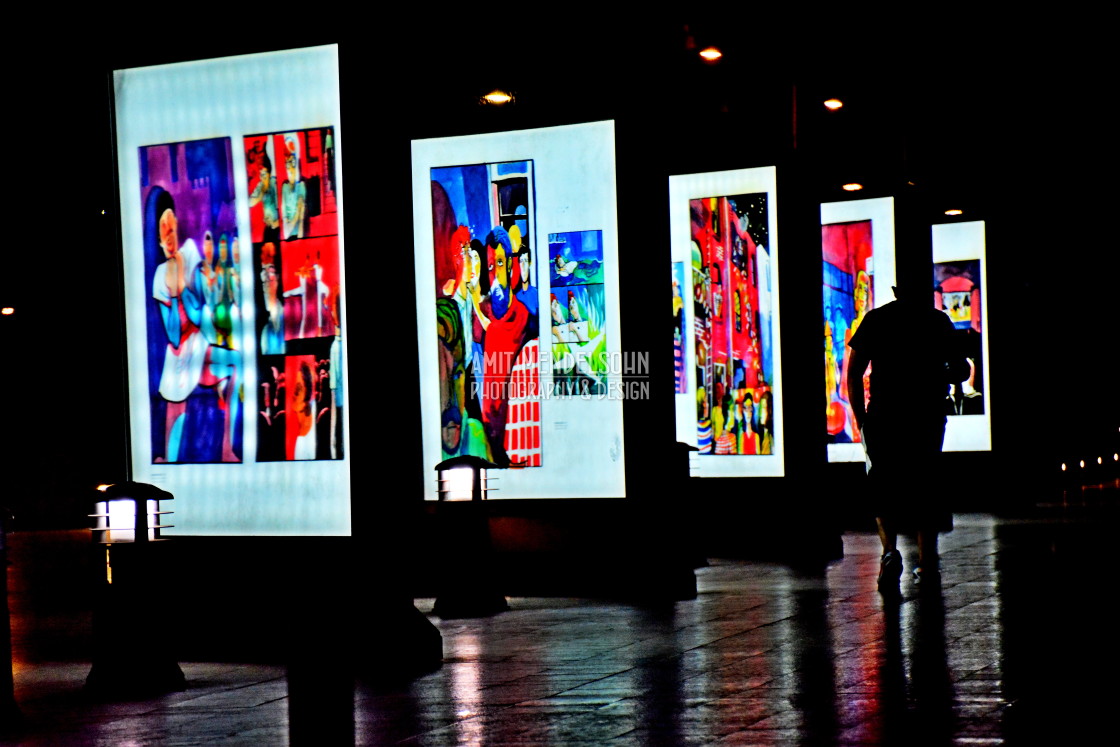 "A man walk by an exhibition" stock image