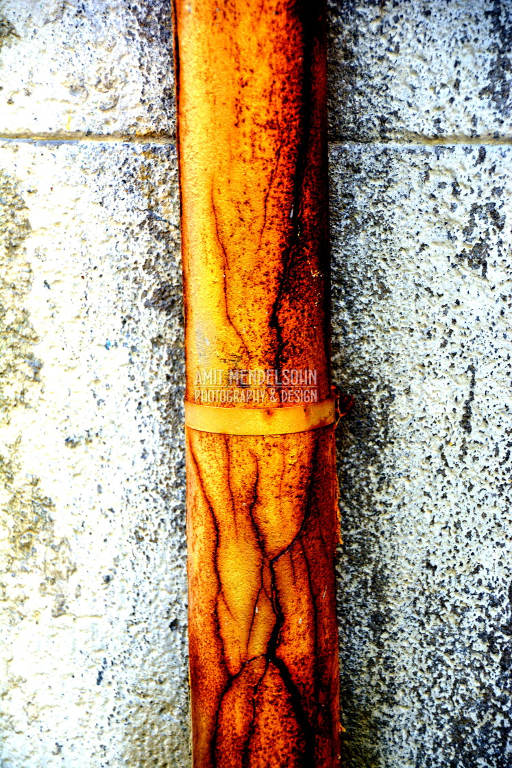 "A cracked rusty pipe" stock image