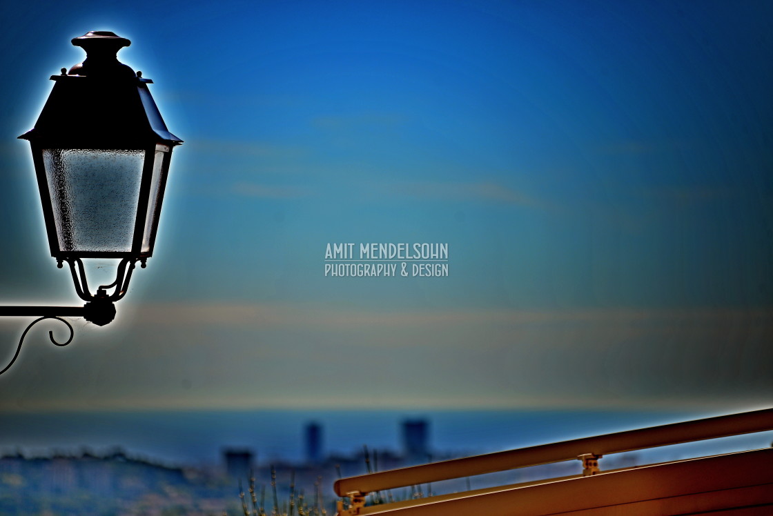 "A lamp and the city in the background" stock image