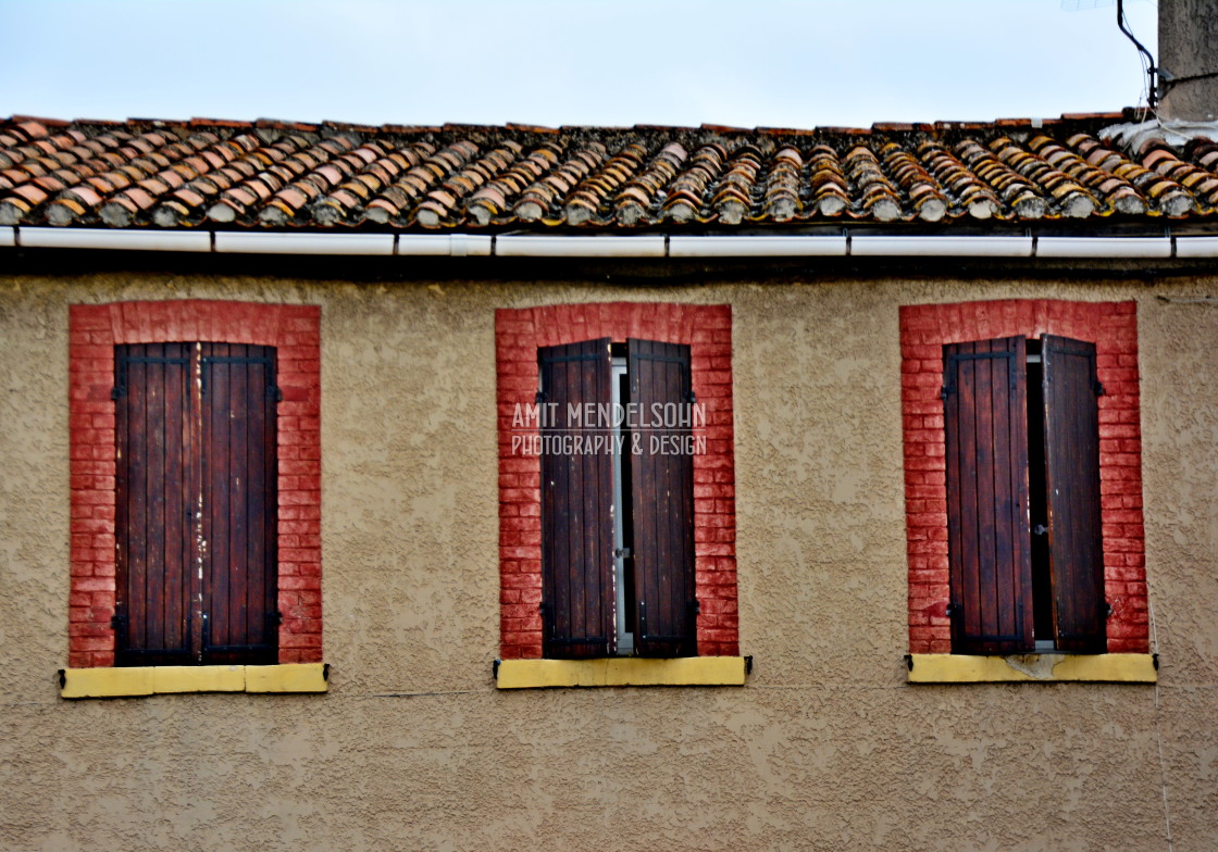 "3 windows framed with bricks" stock image