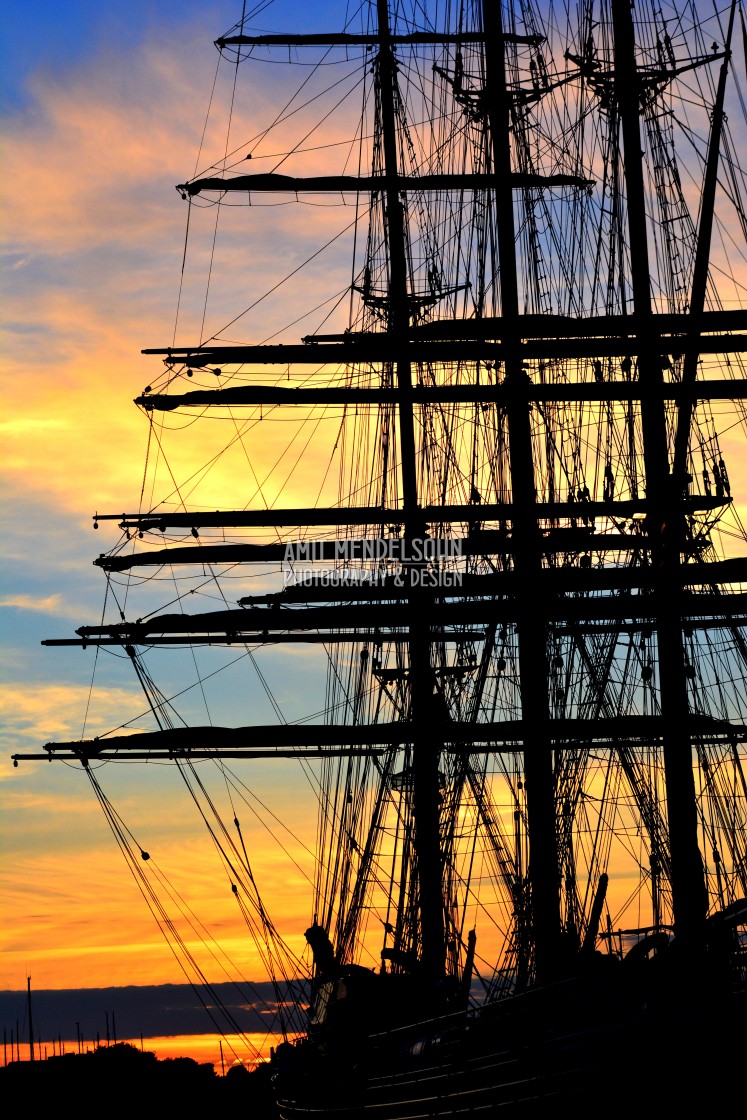 "A mast boat in the sunset" stock image