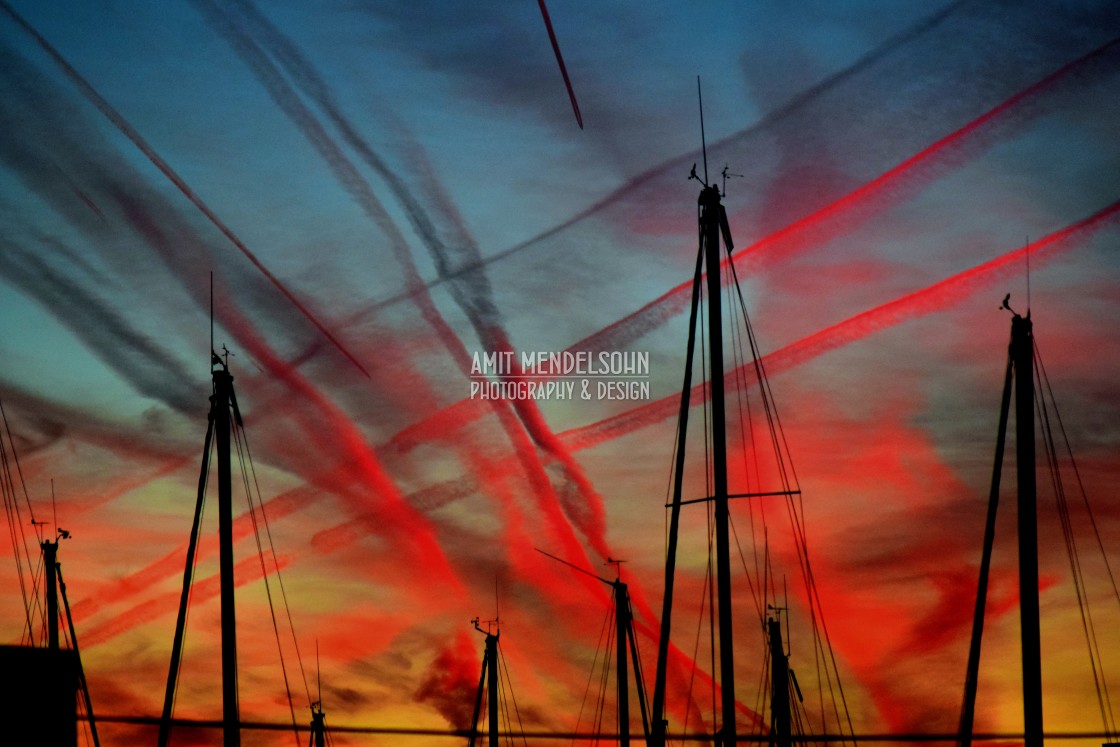 "Airplane trails in the sunset" stock image