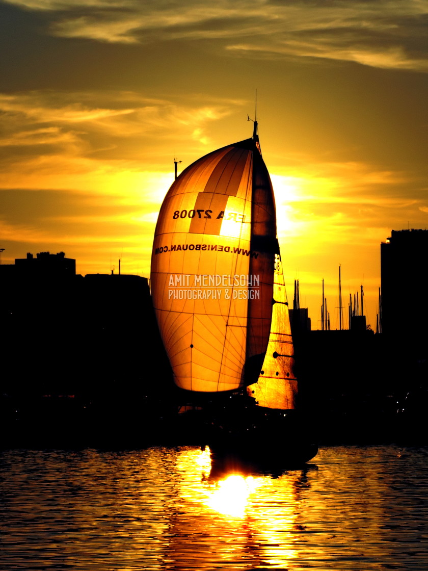 "A sailboat in the sunset" stock image