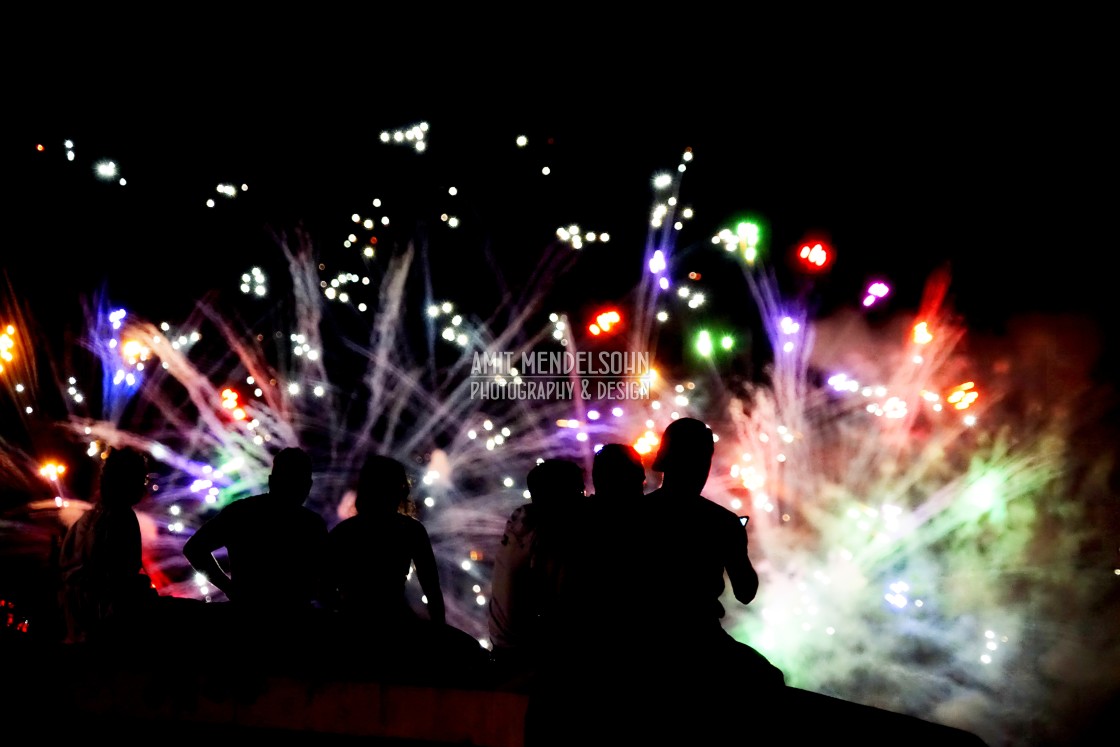 "people watching fireworks" stock image