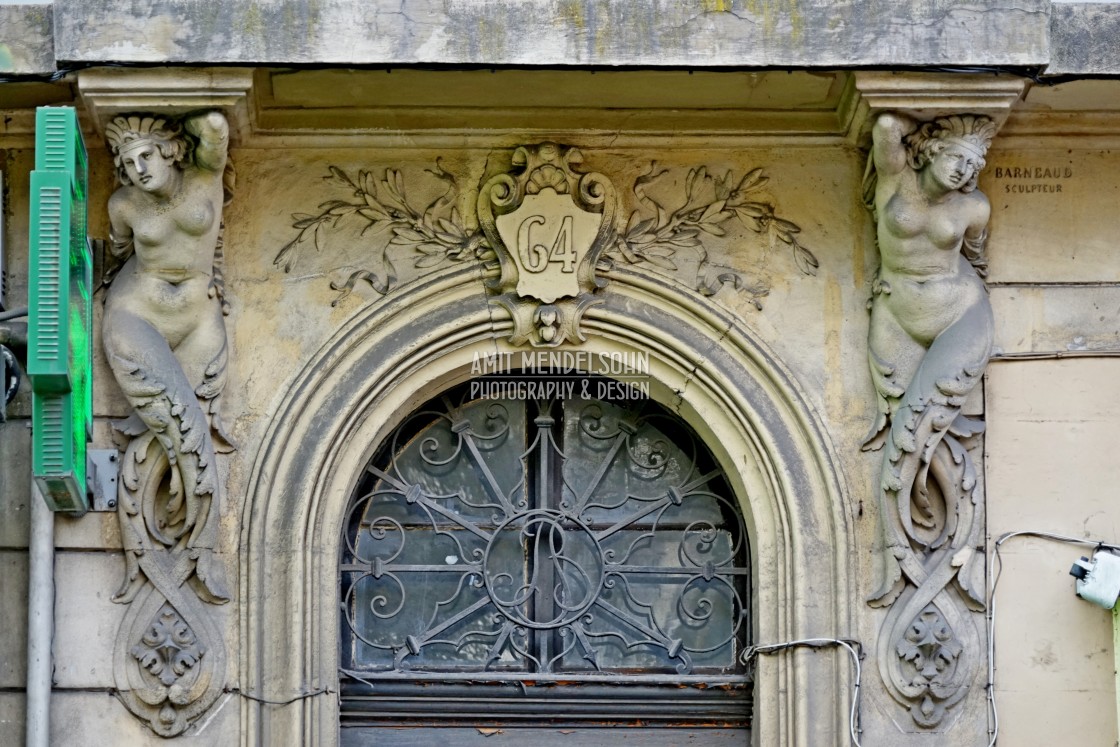 "Caryatid and a decorated door" stock image