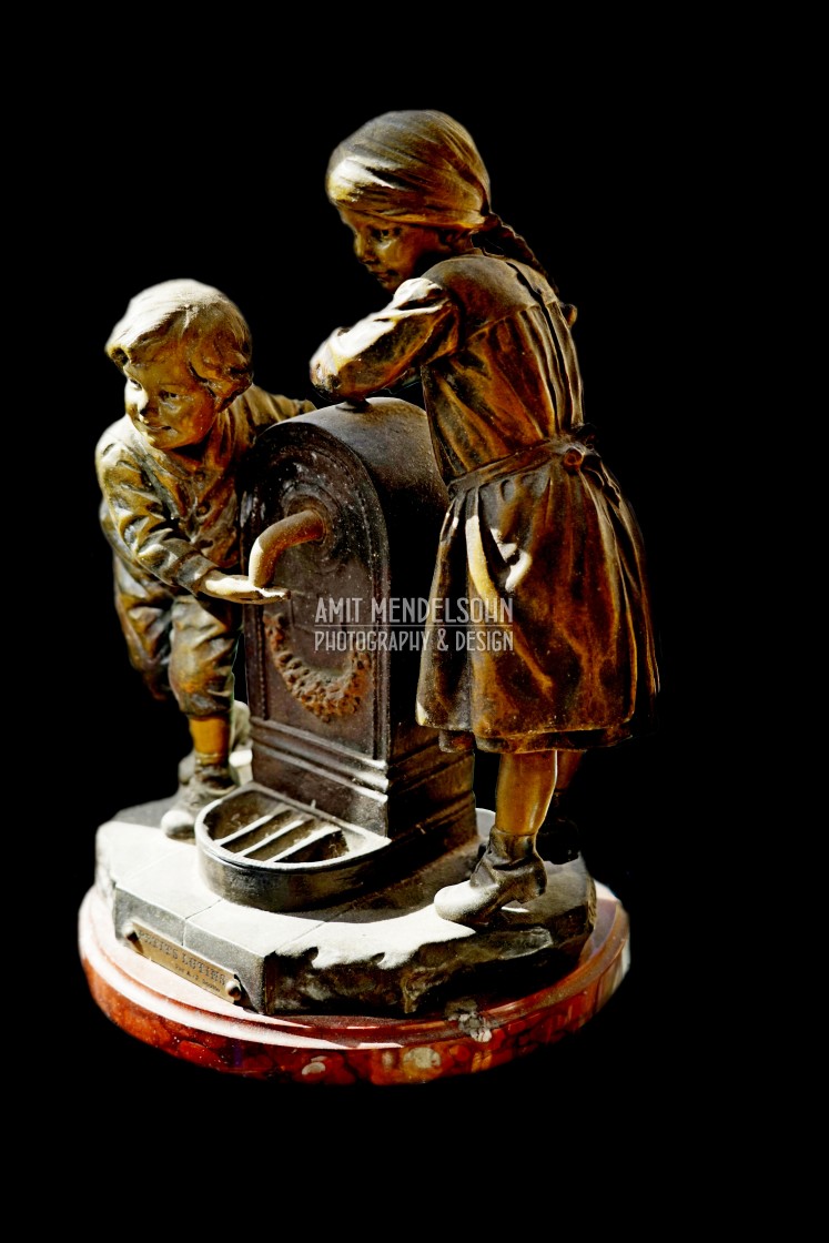 "a boy and a girl and a water fountain" stock image