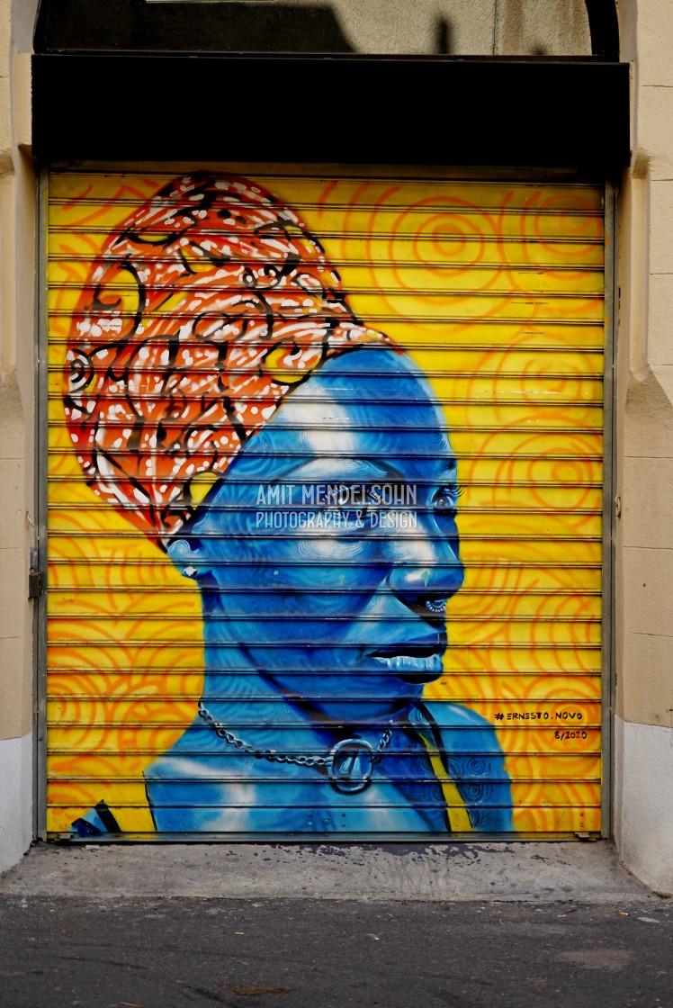 "a mural of an african woman" stock image