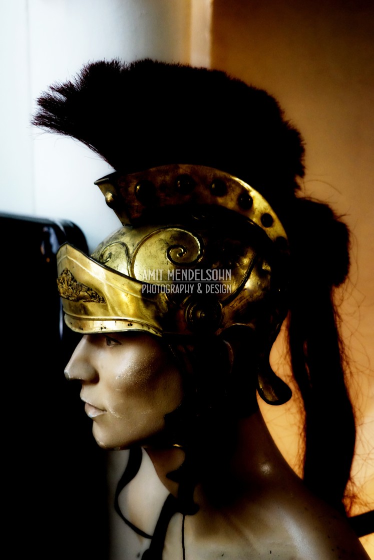 "a mannequin head with a roman helmet" stock image