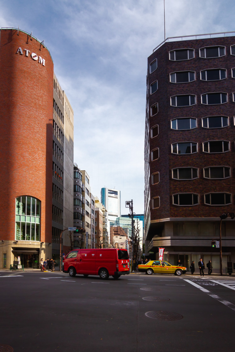 "Japanese Postal Van and Taxi Crossing an Intersection in Tokyo" by Justin Mueller - £10.00 "Japanese Postal Van and Taxi Crossing an Intersection in Tokyo" stock image