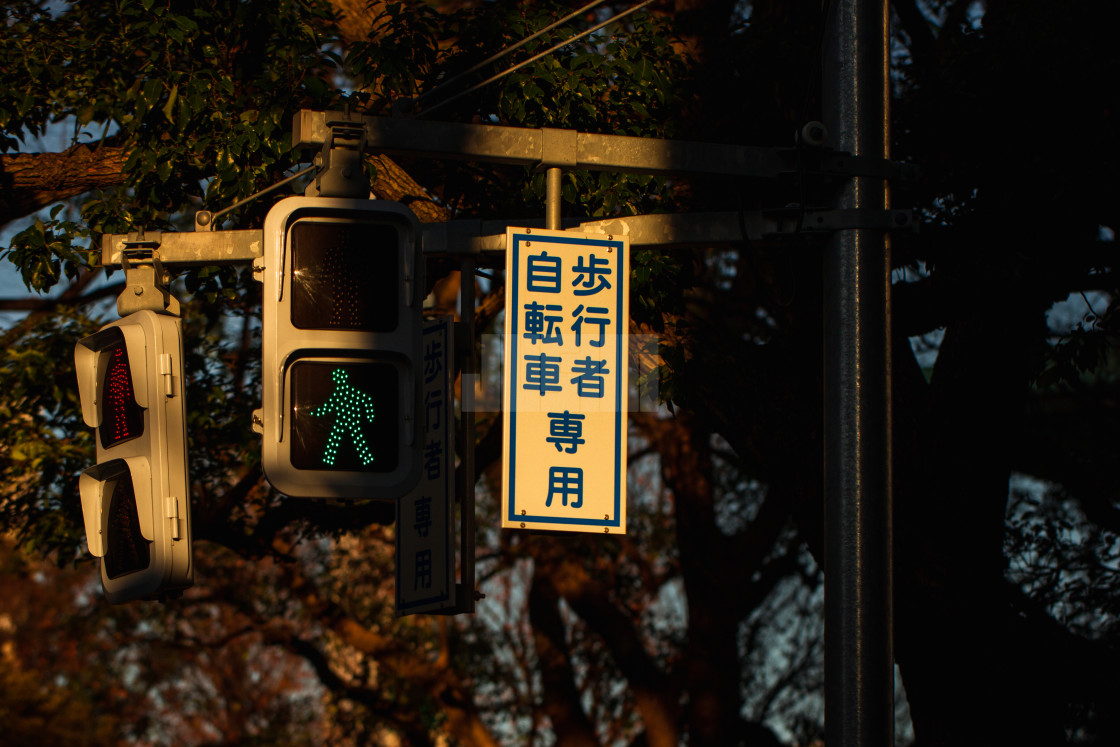 "Japanese Street Crossing Lights at Sunset" by Justin Mueller - £10.00 "Japanese Street Crossing Lights at Sunset" stock image