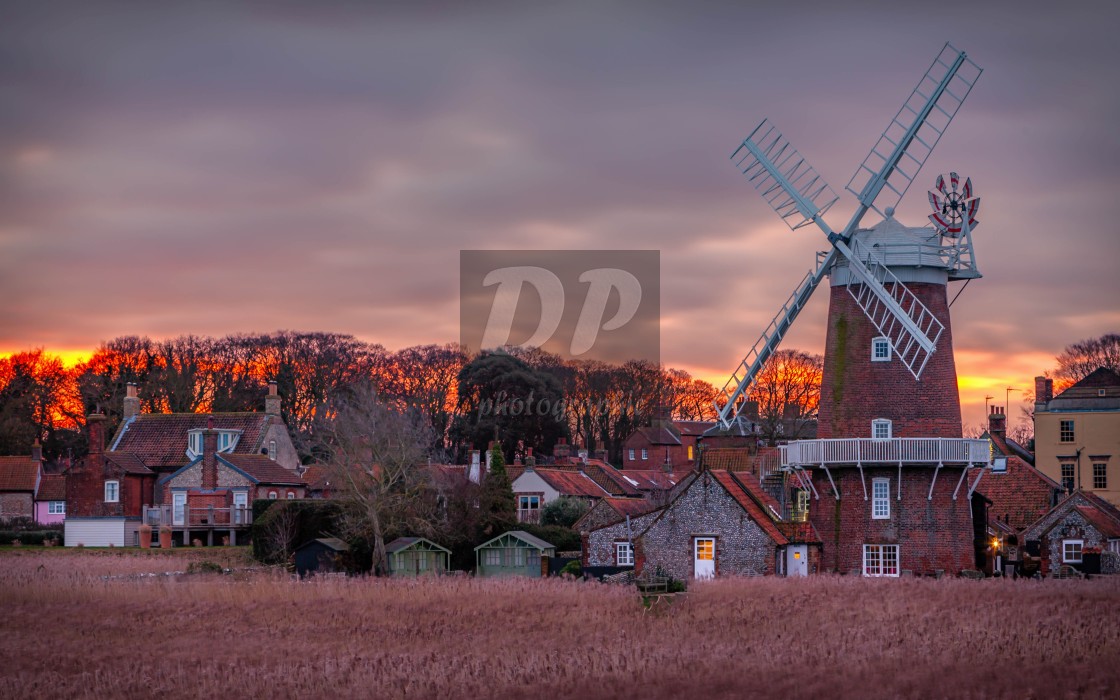 "Winter sunrise behind Cley Mill" stock image