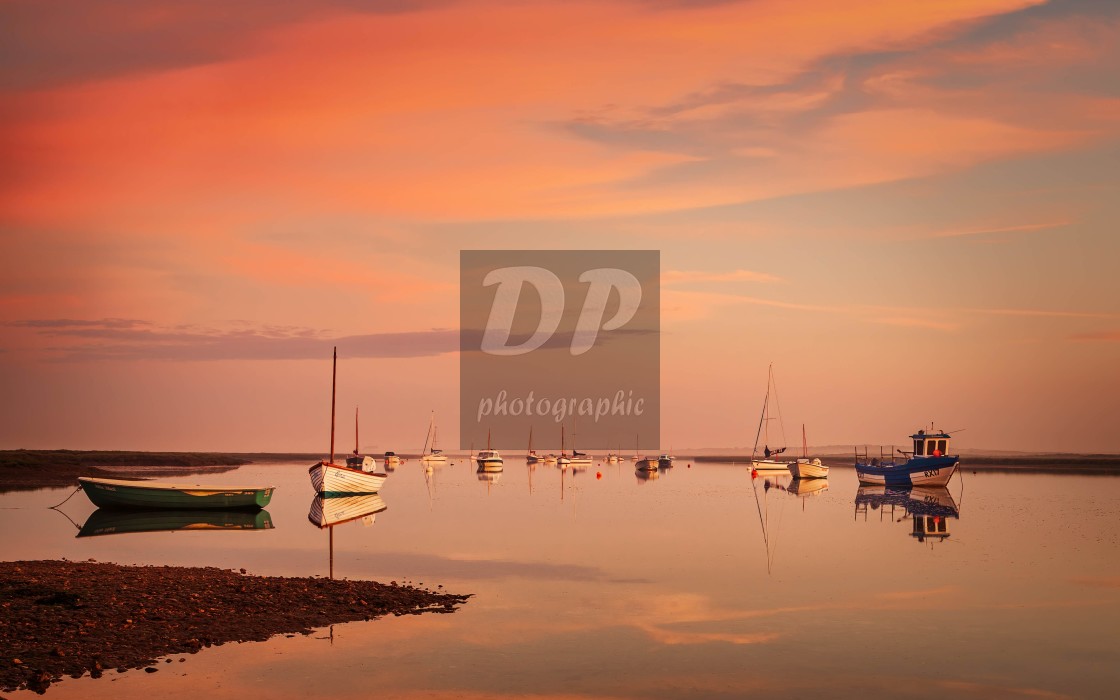 "Dawn reflections at Brancaster Staithe" stock image