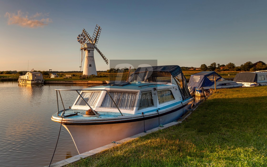 "Evening light over Thurne Mill" stock image