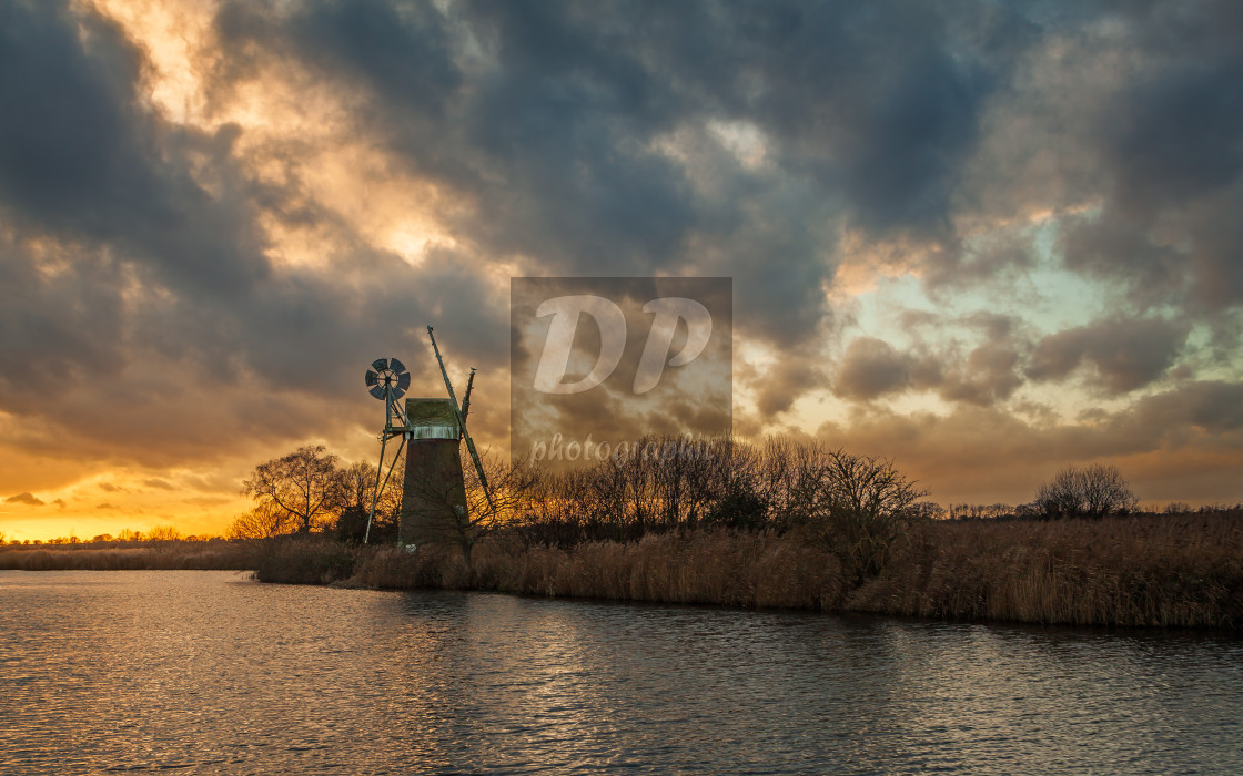 "December Sunset over Turf Fen Mill" stock image