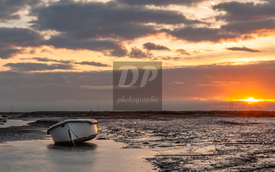 "Low Tide Sunrise at Brancaster Staith Norfolk" stock image