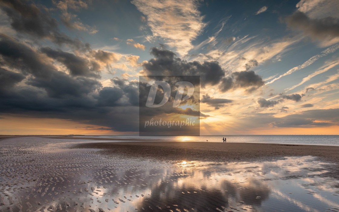 "Sunset Reflections on Brancaster Beach" stock image