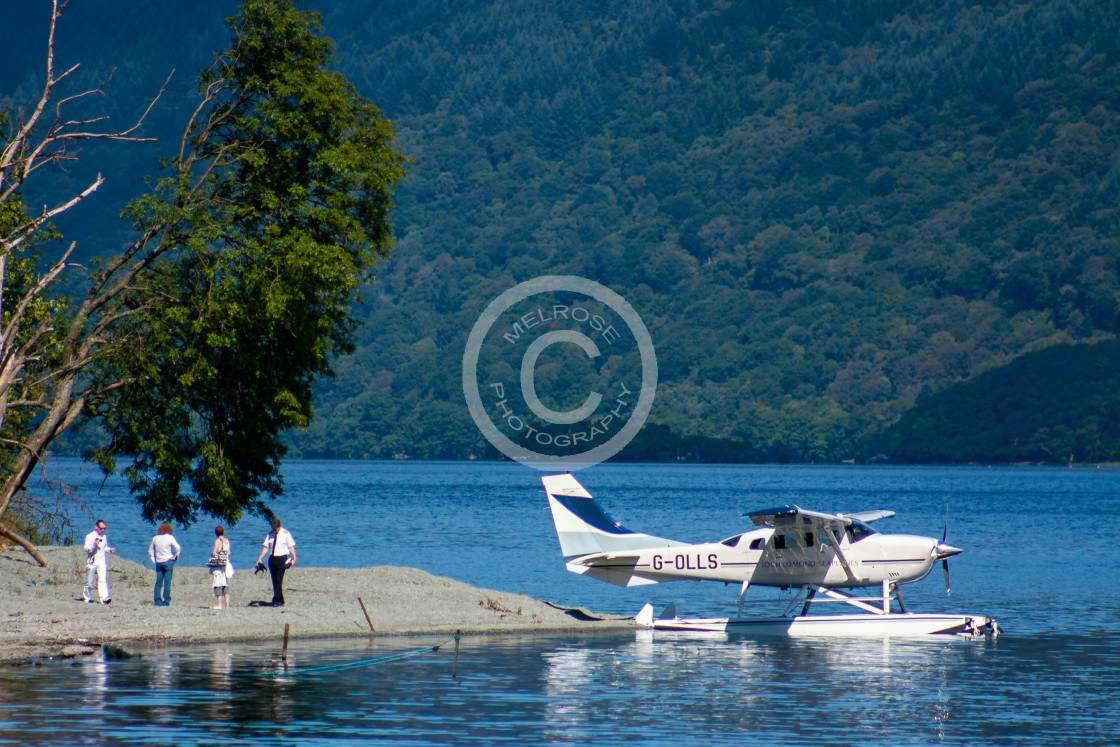 "Loch and Mountain view in Glencoe Scotland with private plane" by Melrose Photography - £10.00 "Loch and Mountain view in Glencoe Scotland with private plane" stock image