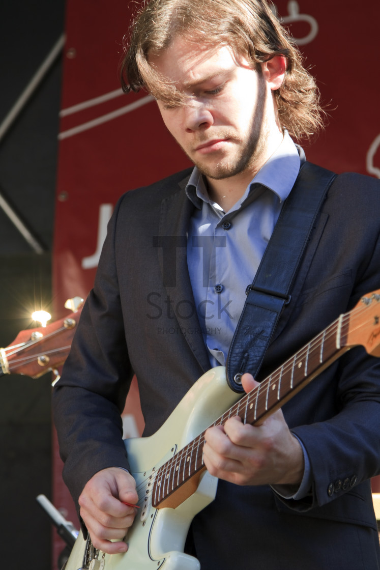 "Martijn Smit plays guitar" by TTStock - $7.32 "Martijn Smit plays guitar" stock image