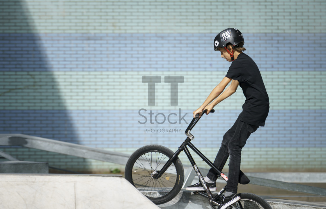 "Young biker wearing helmet" by TTStock - $7.32 "Young biker wearing helmet" stock image