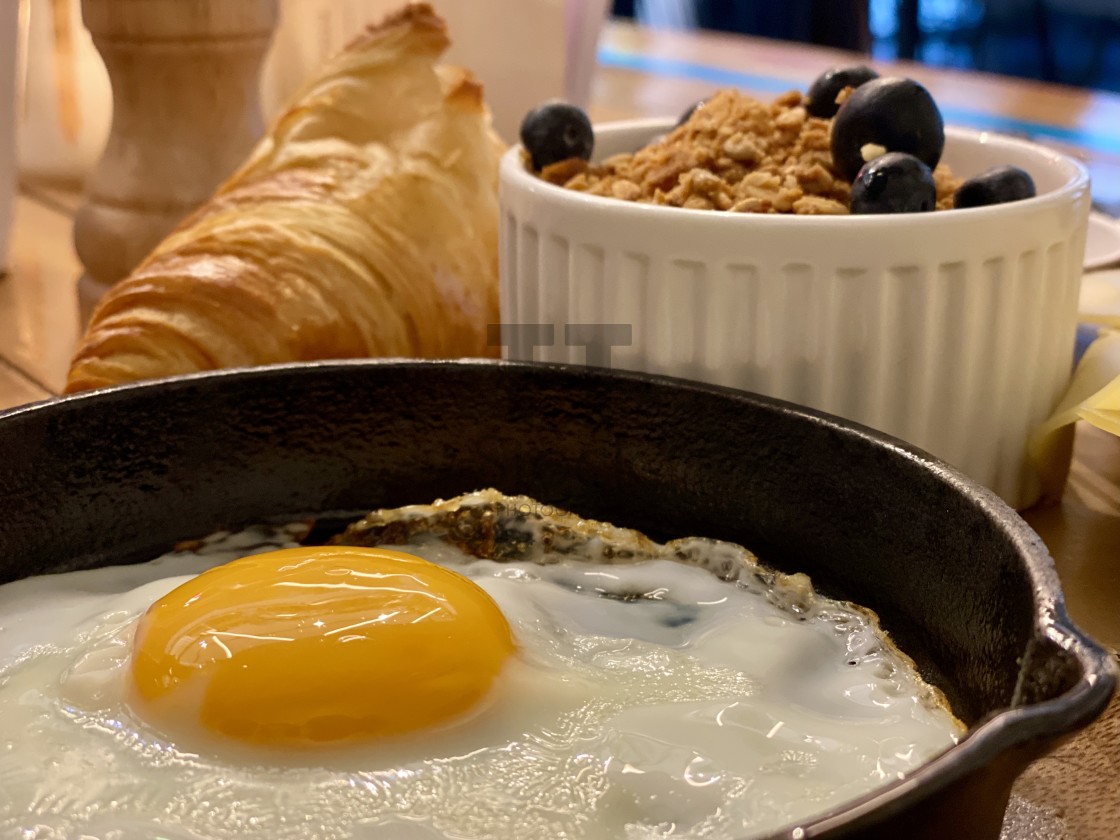 "Breakfast brunch warm food in restaurant, fried egg, cheese, croissant and fresh berries in bowl." by TTStock - $4.90 "Breakfast brunch warm food in restaurant, fried egg, cheese, croissant and fresh berries in bowl." stock image