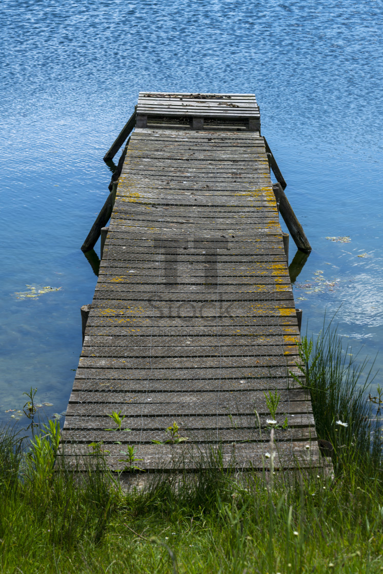 "Wooden jetty on blue water" by TTStock - $5.05 "Wooden jetty on blue water" stock image