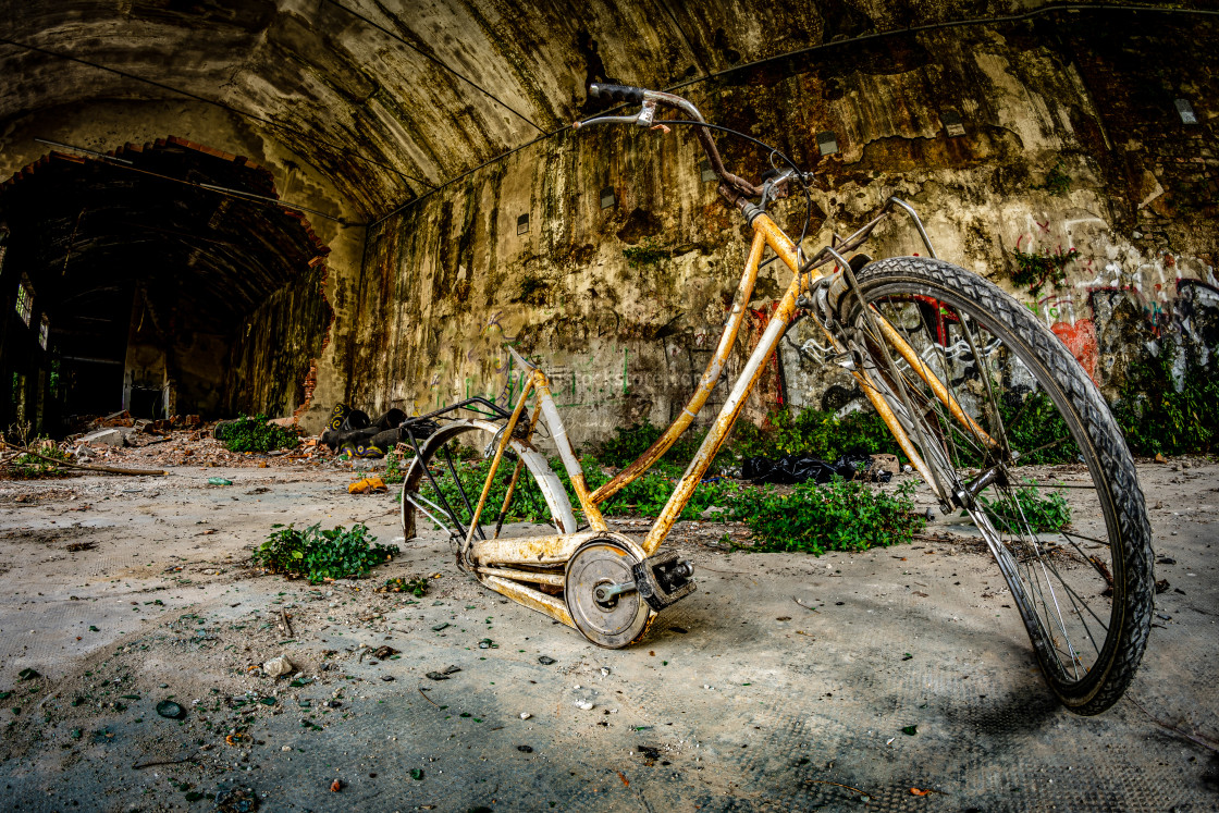 "old abandoned bicycle in an abandoned industrial complex" by Brambilla Simone - £6.72 "old abandoned bicycle in an abandoned industrial complex" stock image