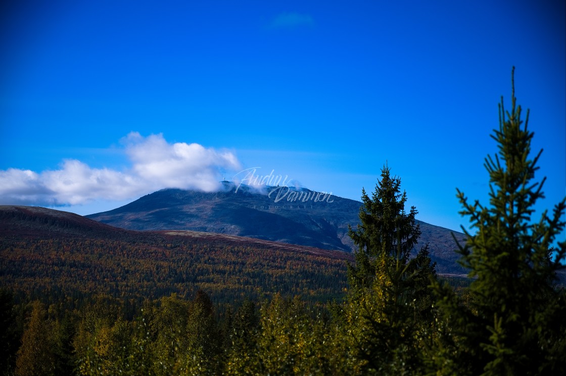 "Mountain slightly covered by clouds" stock image